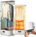 Choisissez le defroisseur portatif qui retouche aussi le linge suspendu en coloris beige et blanc